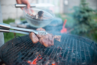 Cropped hand of man preparing food