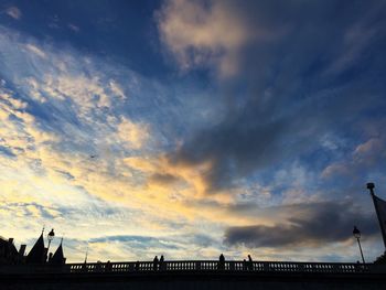 Silhouette birds against sky during sunset