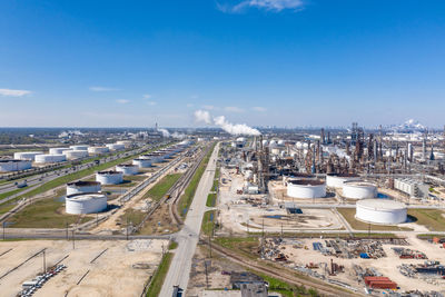 High angle view of cityscape against blue sky