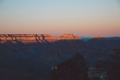 Scenic view of grand canyon against clear sky during sunset