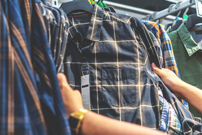 Close-up of man working in rack