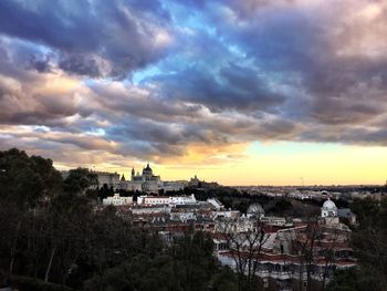 High angle view of town against cloudy sky