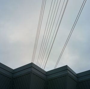 Low angle view of building against cloudy sky