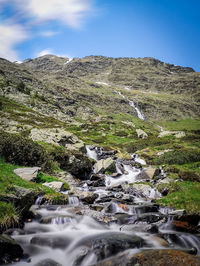 Scenic view of stream against sky