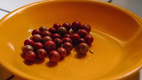 High angle view of raspberries in bowl on table