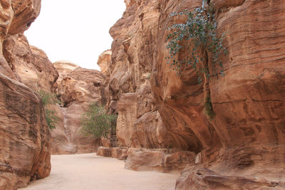 Walkway amidst rock formations at petra