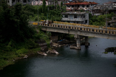 View of bridge over river in city