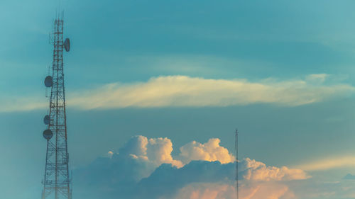 Low angle view of communications tower against sky