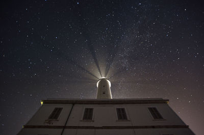 Low angle view of building against sky at night