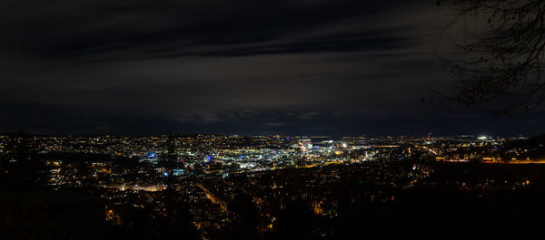 High angle view of illuminated buildings in city at night