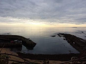 Scenic view of sea against sky at sunset