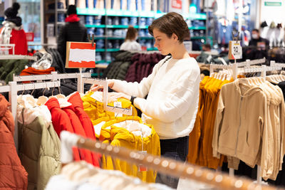 Woman shopping in clothing store