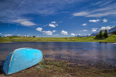 Scenic view of lake against blue sky