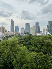 Modern buildings in city against sky