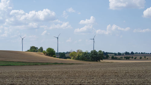 Scenic view of farm against sky