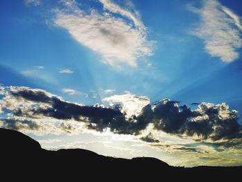 Low angle view of silhouette mountain against sky