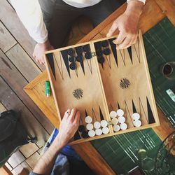 High angle view of men playing backgammon