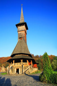 Low angle view of tower against clear blue sky