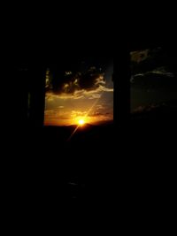 Silhouette trees against sky during sunset