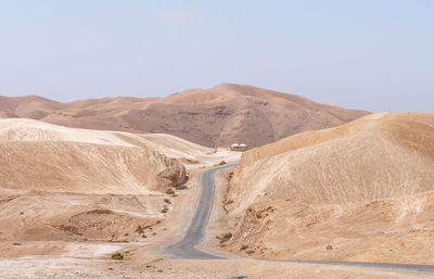 Scenic view of desert against clear sky