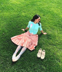 High angle view of woman on grassy field
