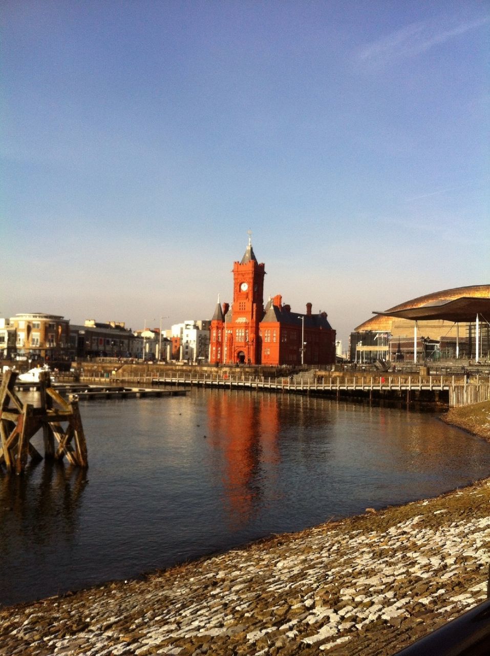 building exterior, architecture, built structure, clear sky, water, copy space, city, river, blue, residential structure, residential building, canal, waterfront, nautical vessel, cityscape, building, house, transportation, residential district, sky