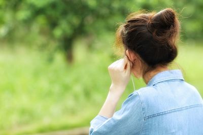 Portrait of woman against plants