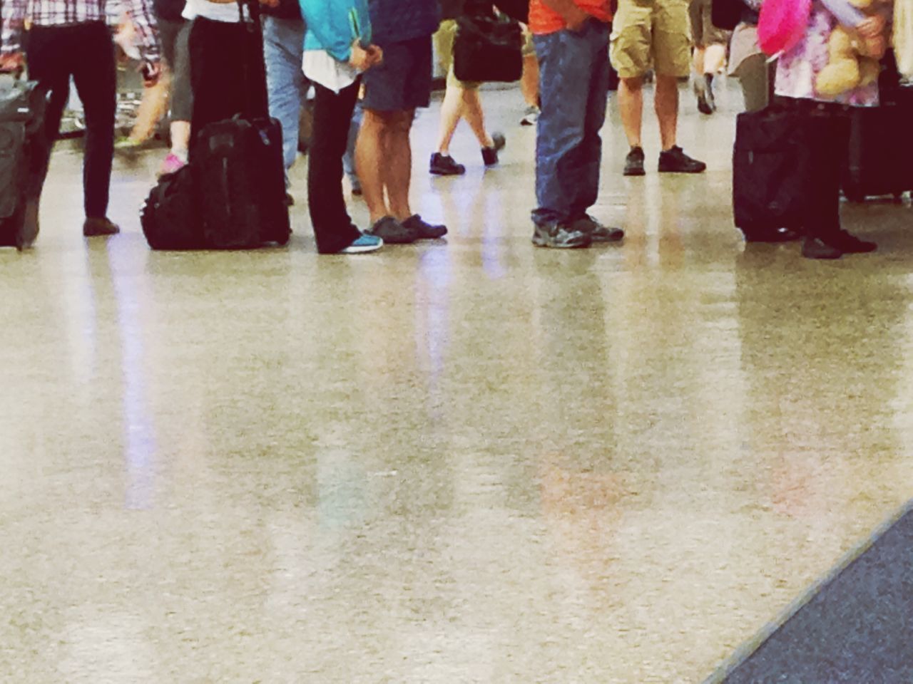 LOW SECTION OF PEOPLE ON FLOOR IN CORRIDOR