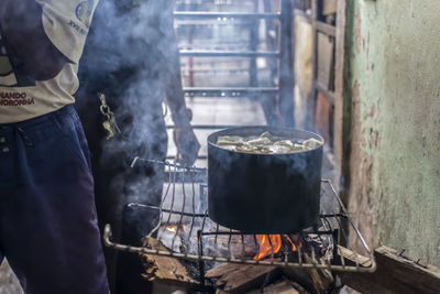 Man working on barbecue grill