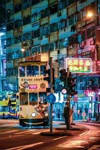 Illuminated city street at night