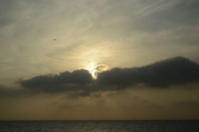 Scenic view of sea against sky at sunset