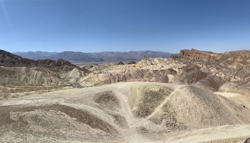 Scenic view of desert against clear sky