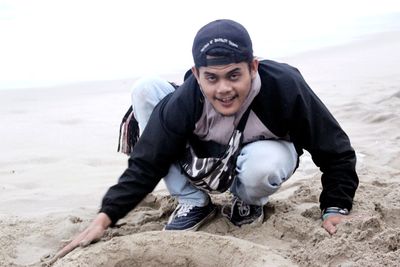 Portrait of smiling man on beach