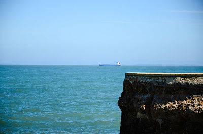 Scenic view of sea against blue sky