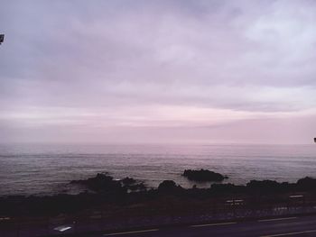 Scenic view of sea against cloudy sky