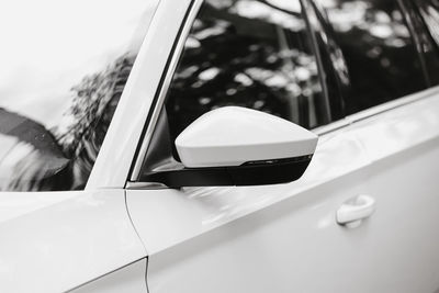 Close-up of car on road