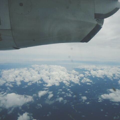 airplane, flying, air vehicle, transportation, sky, mode of transport, cloud - sky, aircraft wing, part of, travel, aerial view, mid-air, cropped, cloud, cloudy, nature, cloudscape, journey, public transportation, day