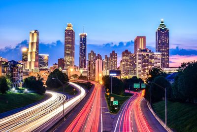 Light trails on road in city at night