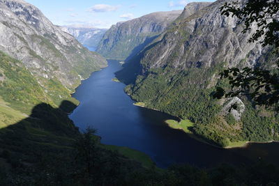 Scenic view of river amidst mountains