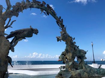 Statue by sea on cozumel island in mexico 