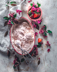 Strawberry ice cream balls with berries and mint leaves in white bowl. high quality photo