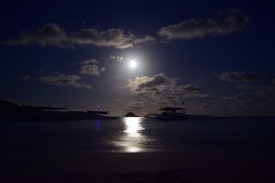 Scenic view of sea against sky at night