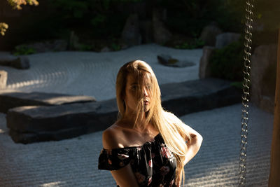 Portrait of woman standing outdoors