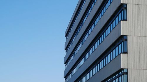 Low angle view of skyscraper against clear sky