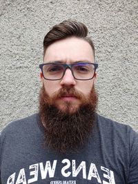 Portrait of young man wearing eyeglasses standing outdoors