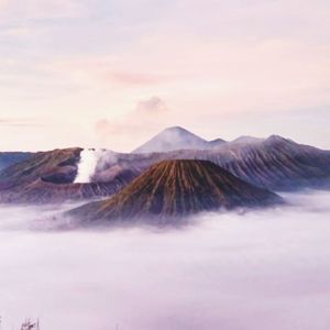 View of volcanic mountain against cloudy sky