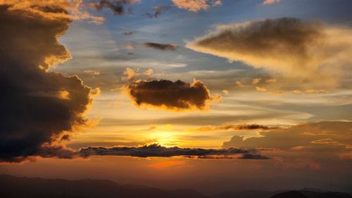 Low angle view of dramatic sky during sunset