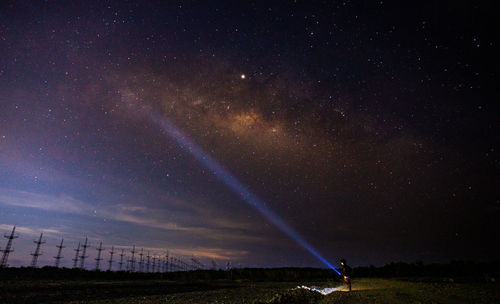 Scenic view of field against sky at night