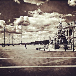 City street against cloudy sky