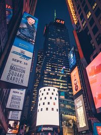 Low angle view of illuminated buildings at night